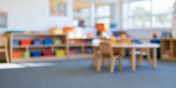 A preschool classroom, softly out of focus